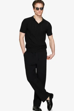 Black perforated knit polo shirt