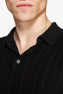 Black perforated knit polo shirt