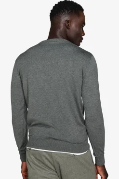 Green V-neck sweater