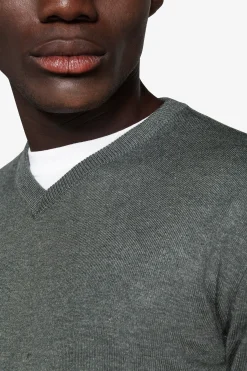 Green V-neck sweater