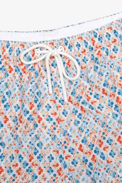 Orange lily print swim trunks